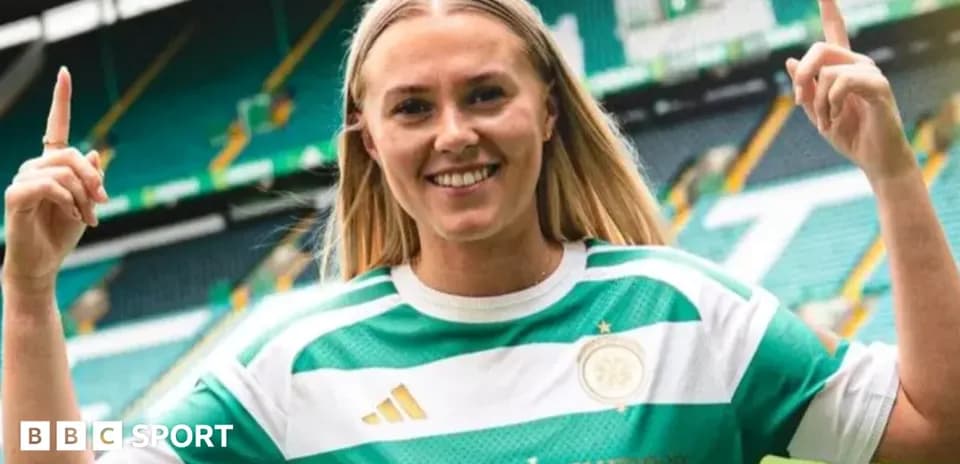 Player celebrating in Celtic jersey at stadium
