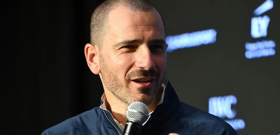Speaker holding microphone at event podium