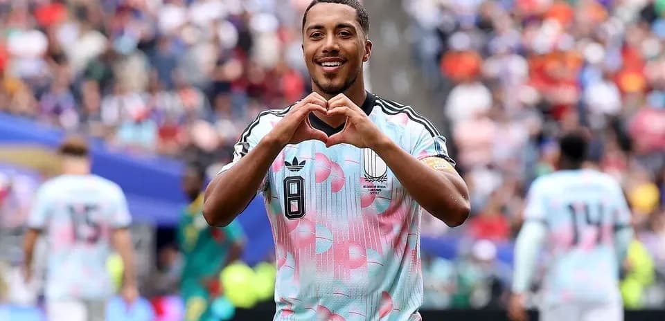 Player celebrating by making heart gesture after scoring