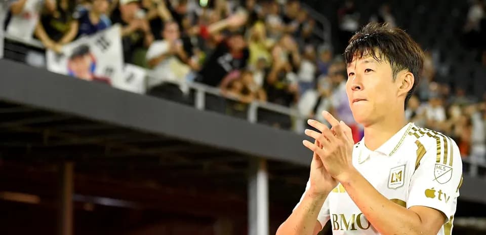 Player applauding fans during match celebration