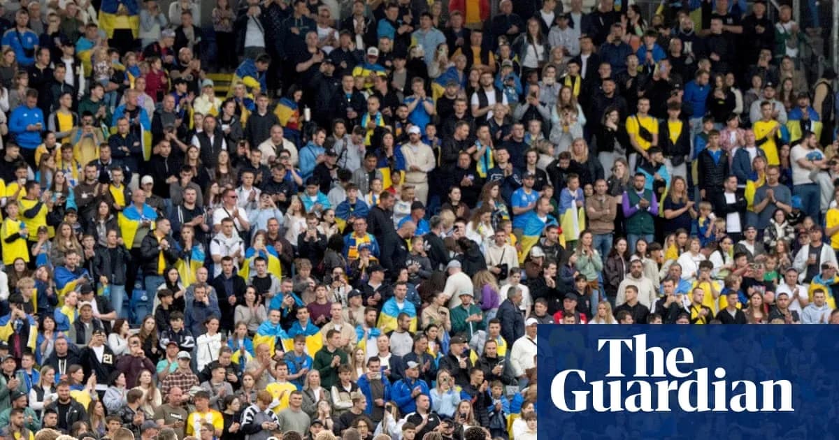 Crowd of fans in stadium supporting their team