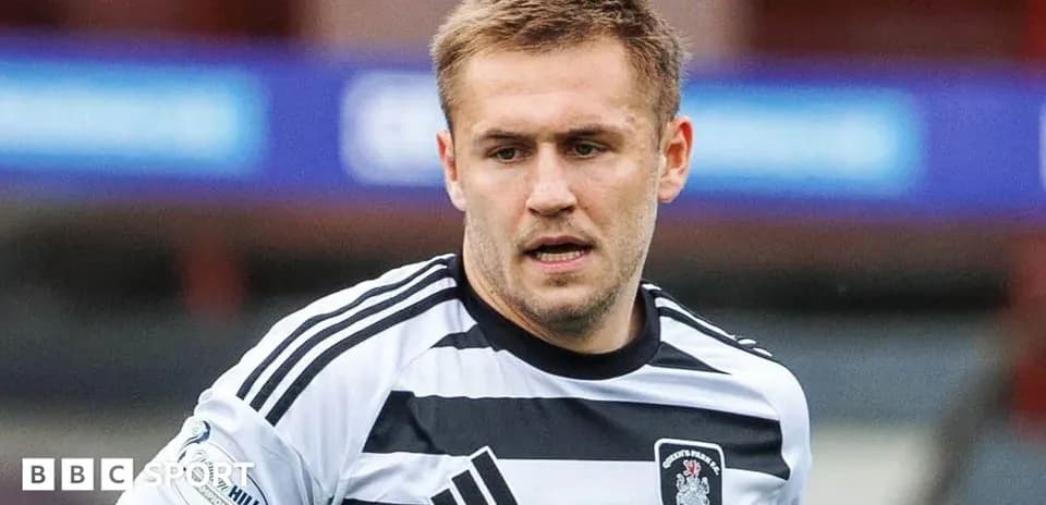 Player in striped jersey during a match