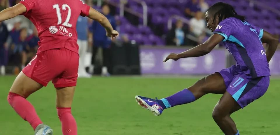 Player kicking ball during Orlando Pride match