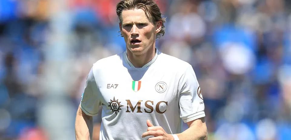 Player running in Napoli's white home jersey