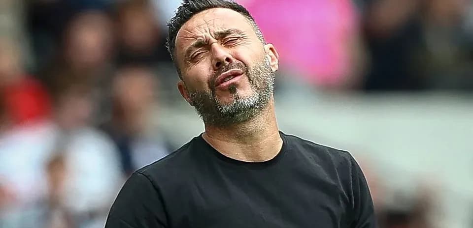 Coach reacting during a match on the sidelines