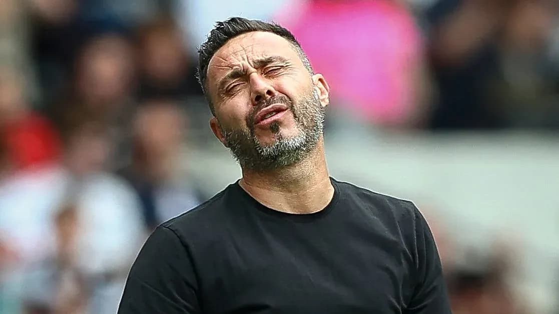 Coach reacting during a match on the sidelines