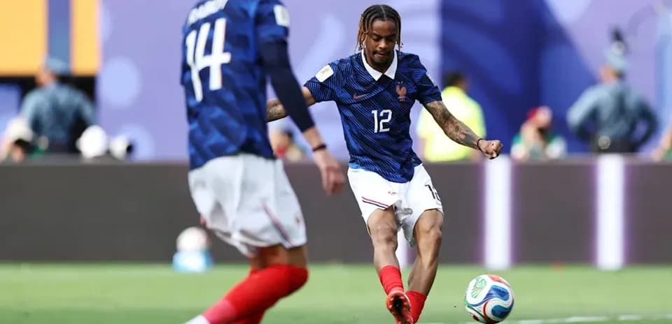 French player kicking the ball during match