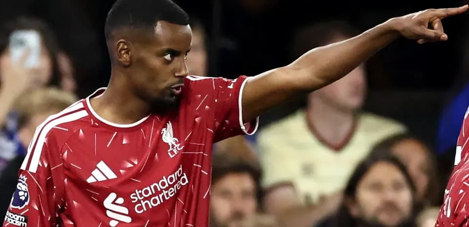 Player pointing during a match for Liverpool