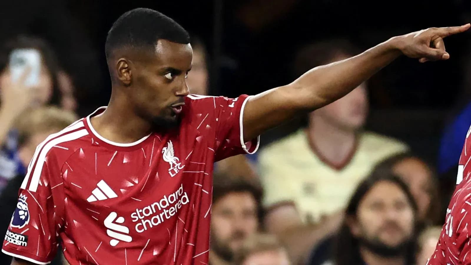 Player pointing during a match for Liverpool