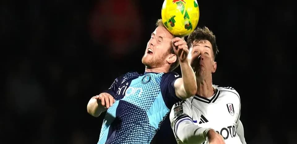 Two players contesting a high ball during match