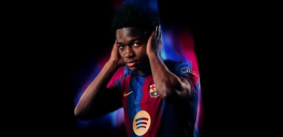 Player in FC Barcelona jersey covering ears