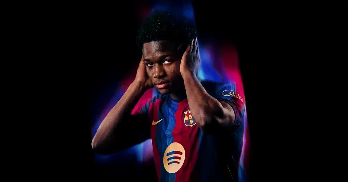 Player in FC Barcelona jersey covering ears