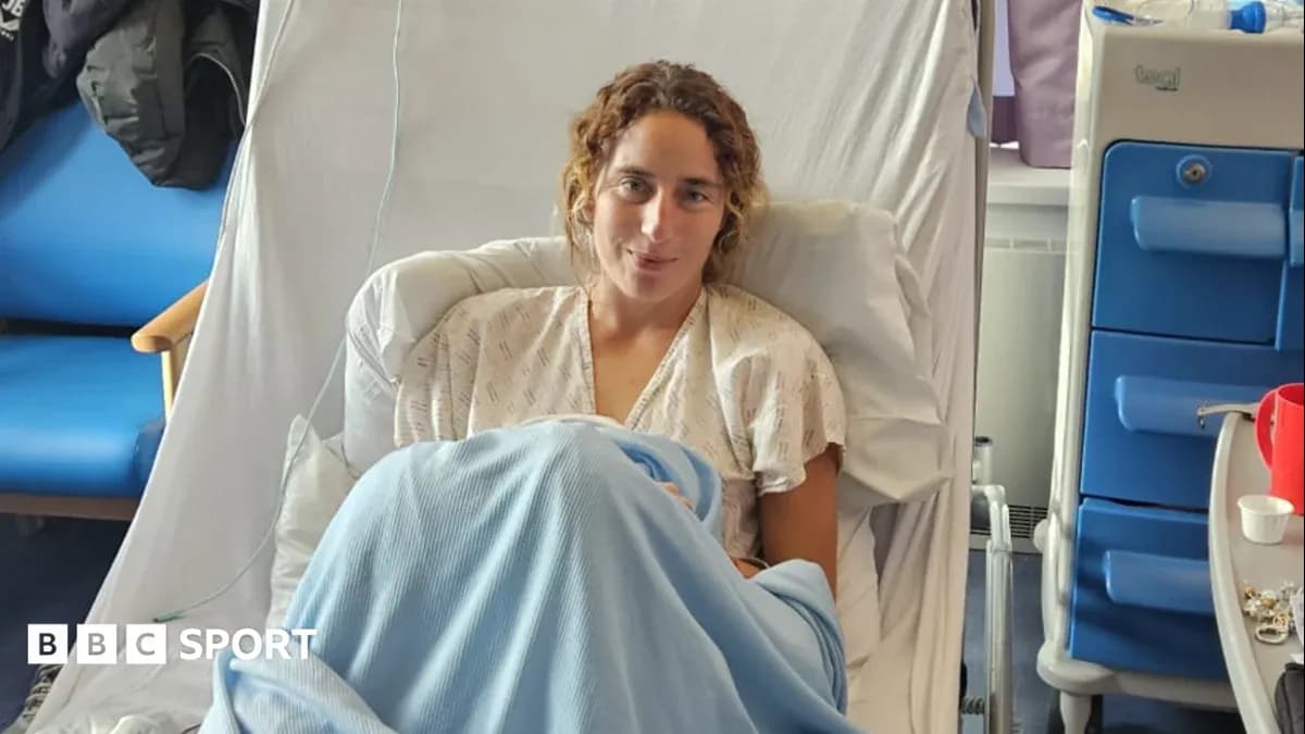 Athlete resting in hospital bed with blanket