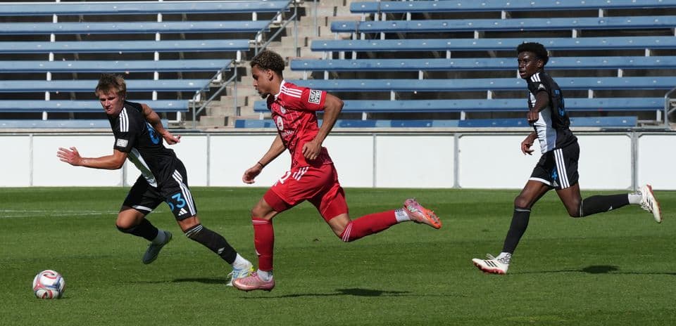 Players competing for the ball during match