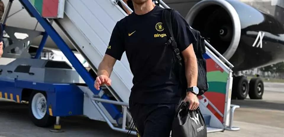 Coach arriving at airport with team gear