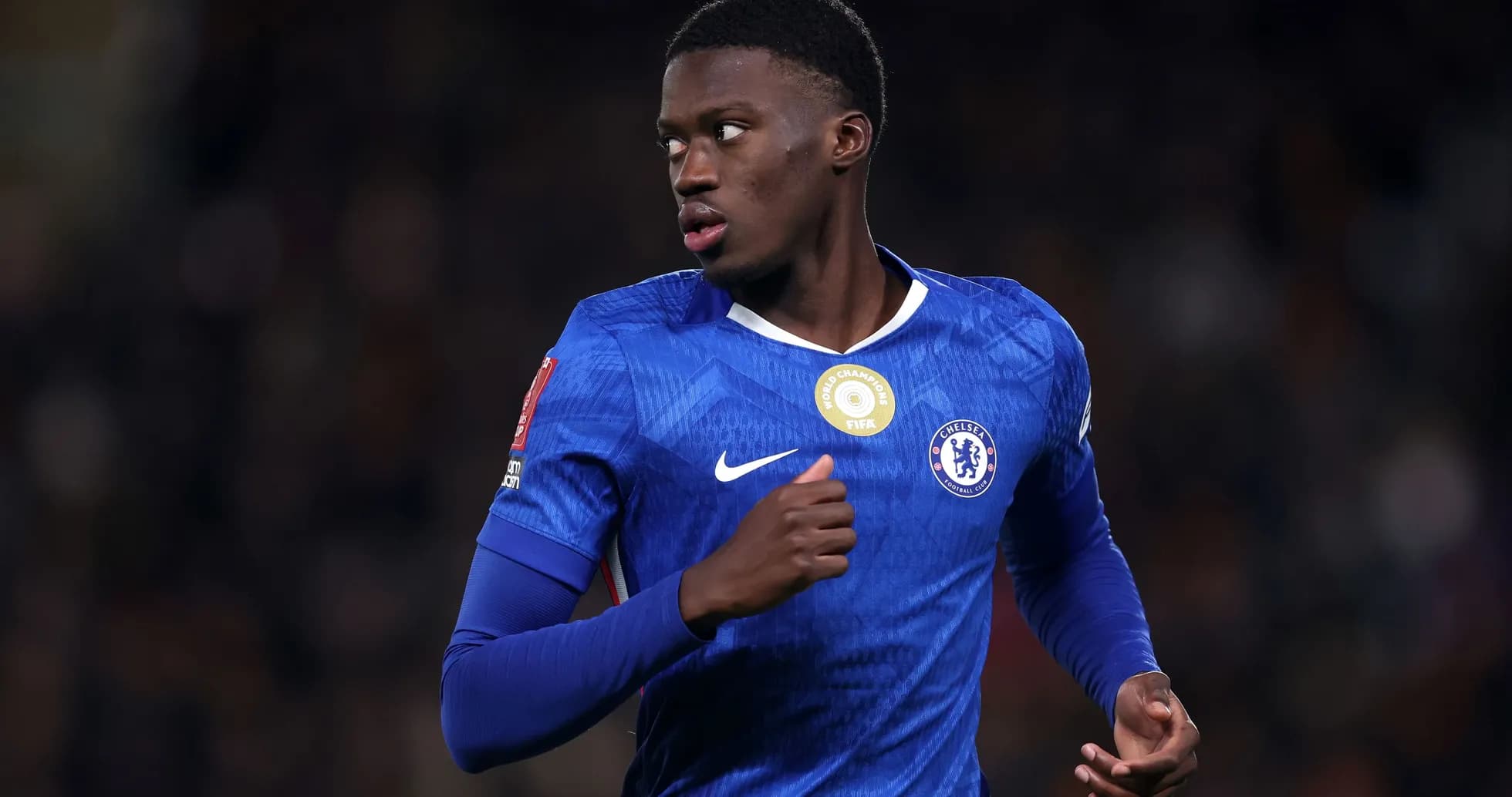 Chelsea player running on the pitch during match