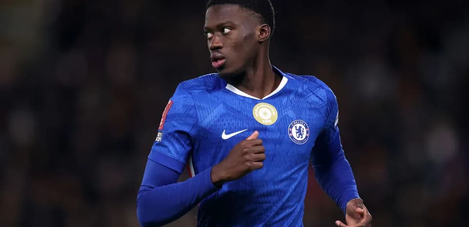 Chelsea player running on the pitch during match