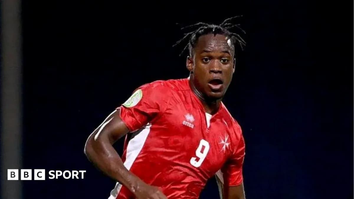 Player in red jersey running on the field