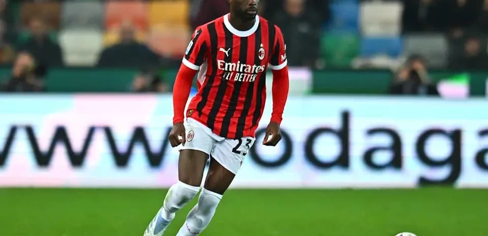 AC Milan player dribbling the ball on field