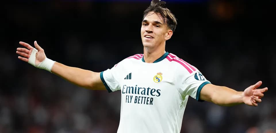 Player celebrating during match in Real Madrid jersey