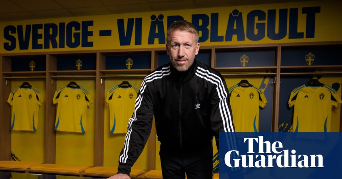 Coach posing in locker room with Swedish jerseys