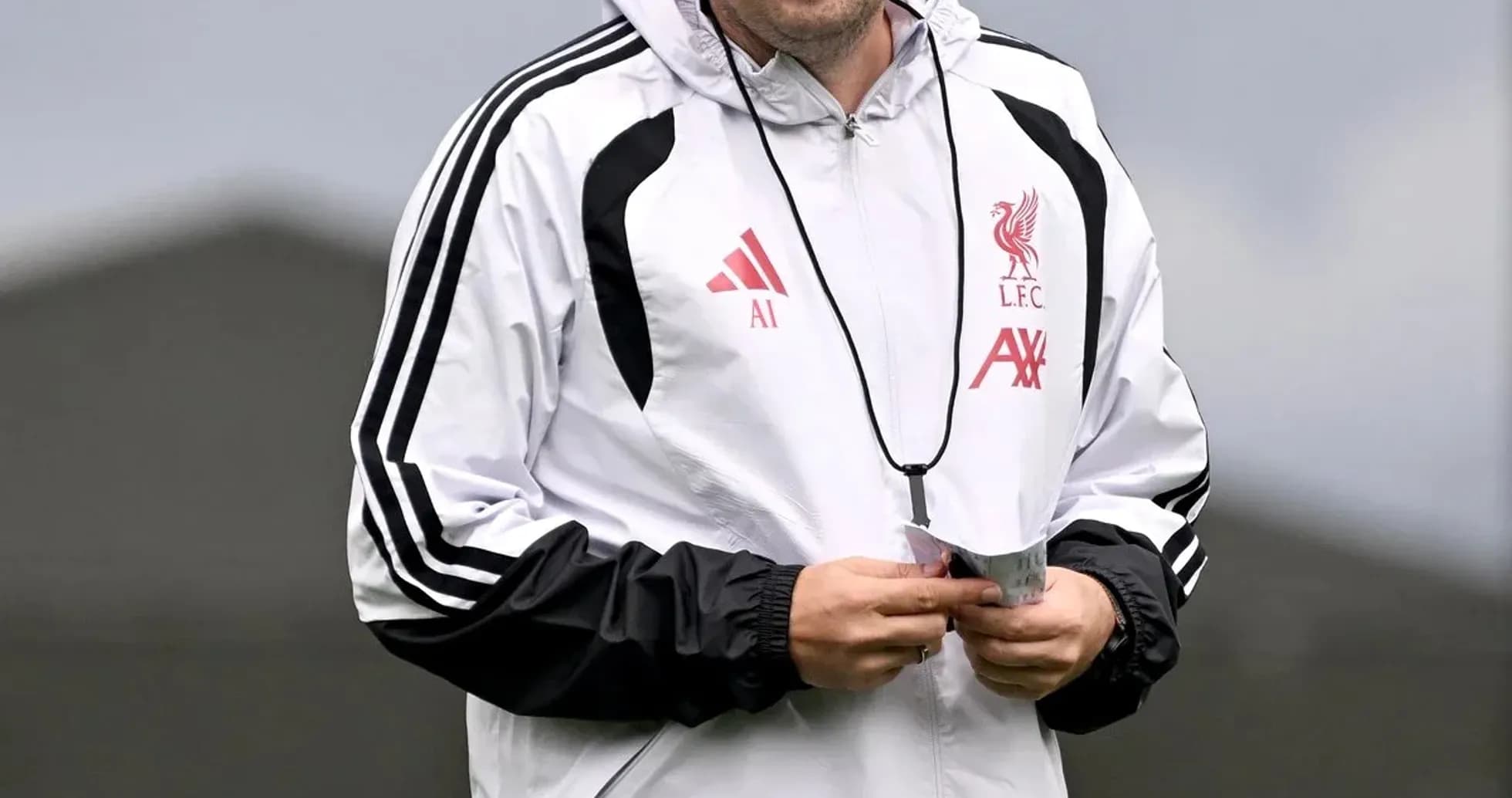 Coach smiling during Liverpool training session