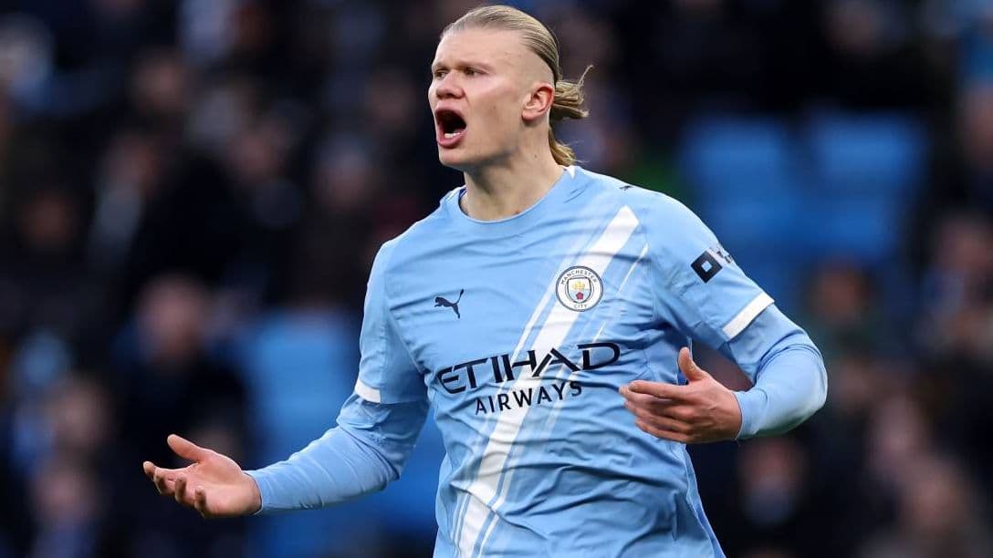 Player reacting during match in light blue jersey