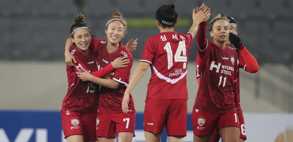 Players celebrating a goal during WK-League match