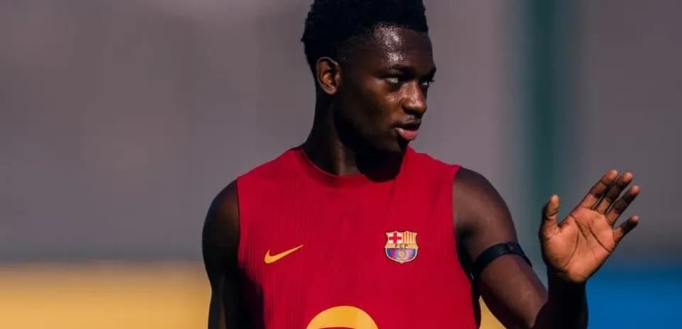Player in Barcelona training kit waving during practice