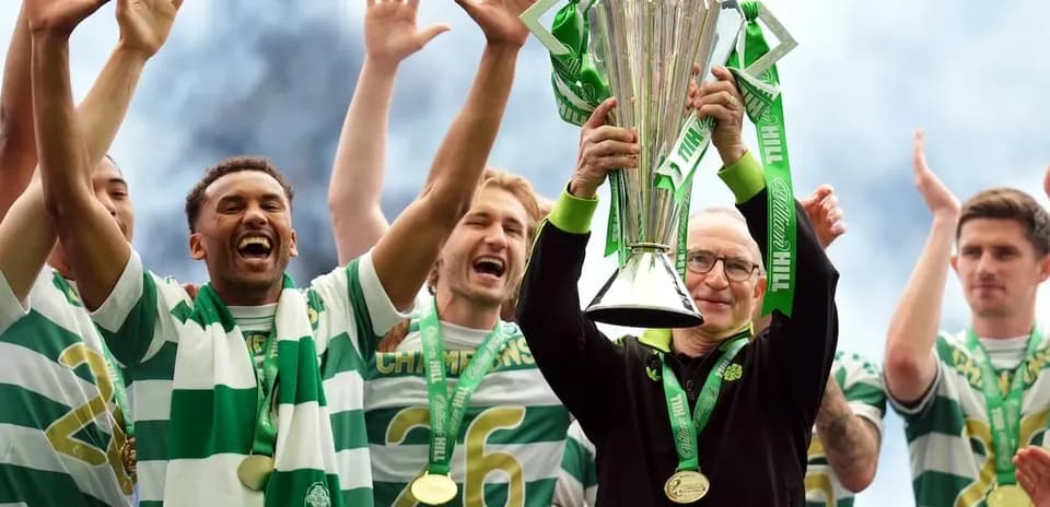 Team celebrating with trophy after winning championship