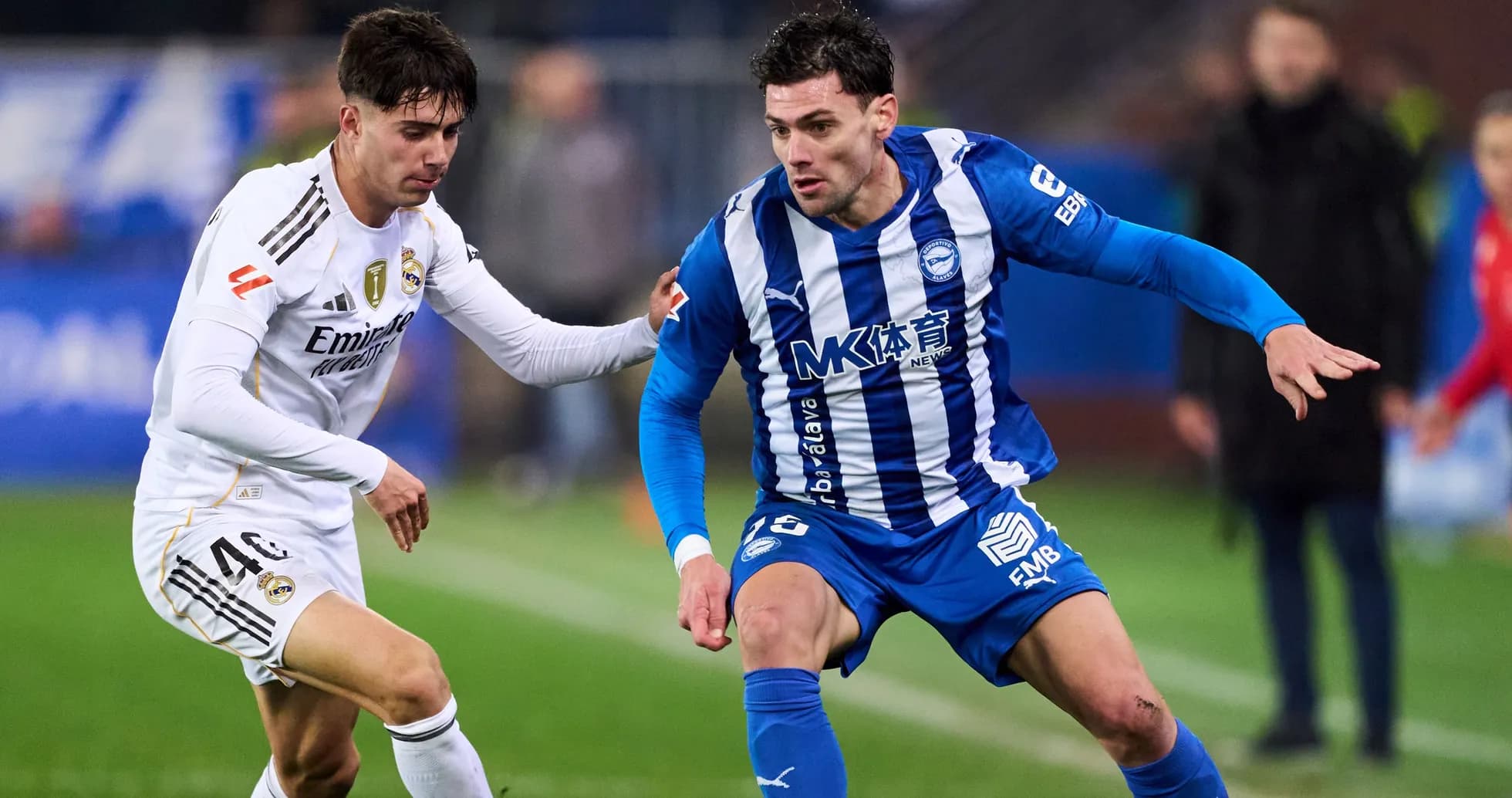 Two players competing for the ball during match