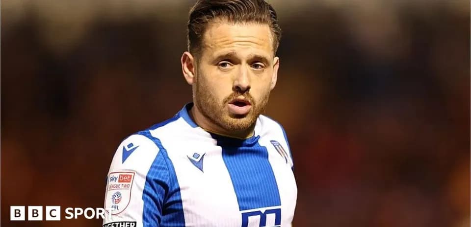 Player in blue and white jersey during match