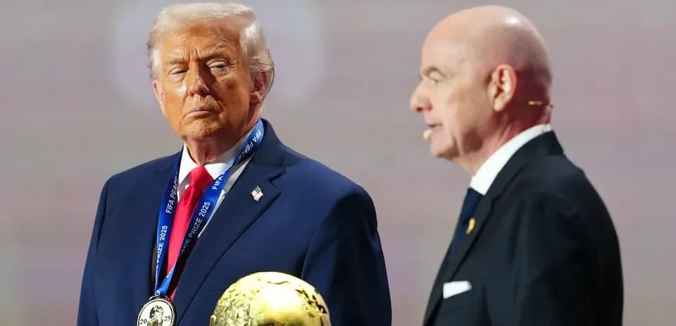 Donald Trump holding FIFA prize with official beside