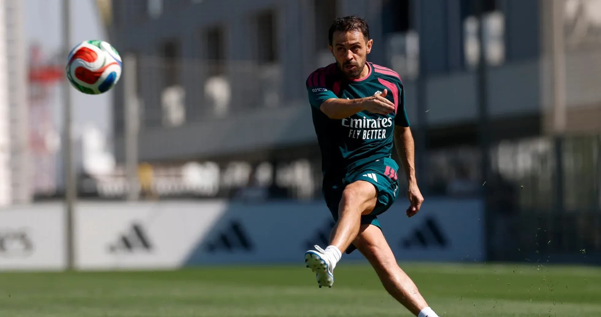Player striking a soccer ball during training session