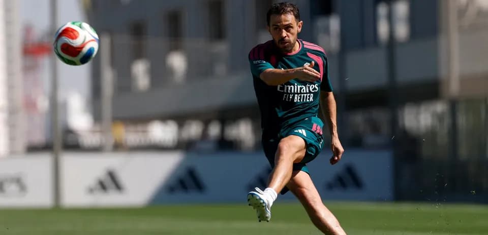 Player striking a soccer ball during training session