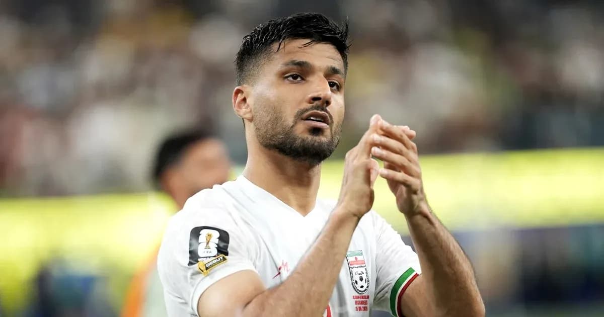 Player applauding fans after match in stadium