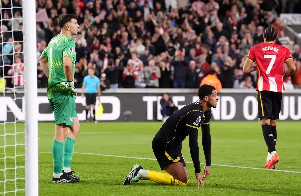 Goalkeeper and player reacting after conceding a goal