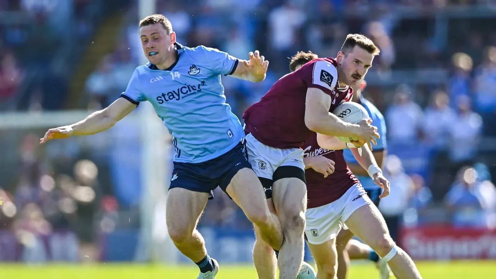 Player tackling opponent while running with the ball