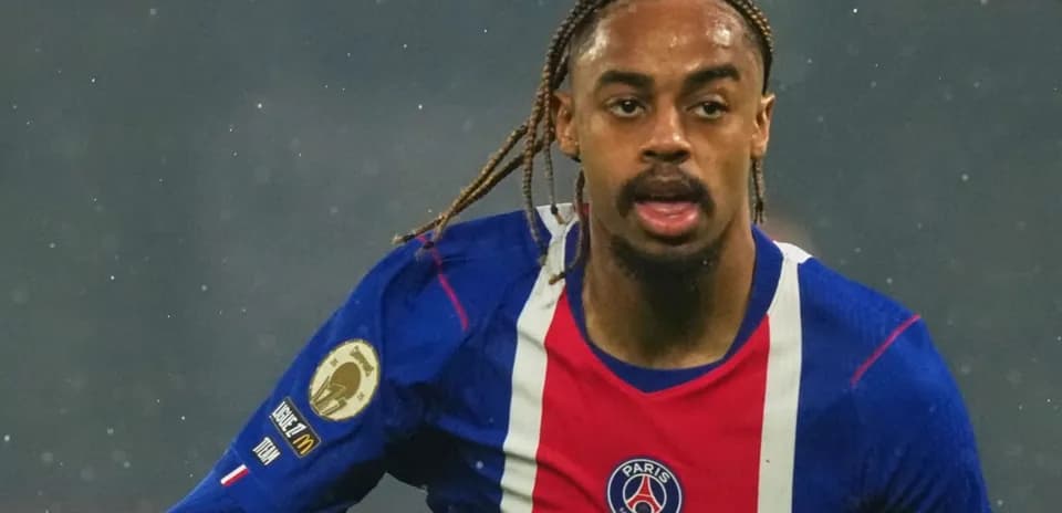 Player running on the field in PSG kit