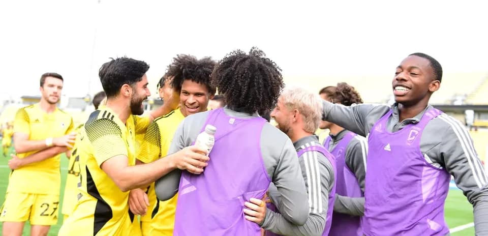 Players celebrating after the match victory
