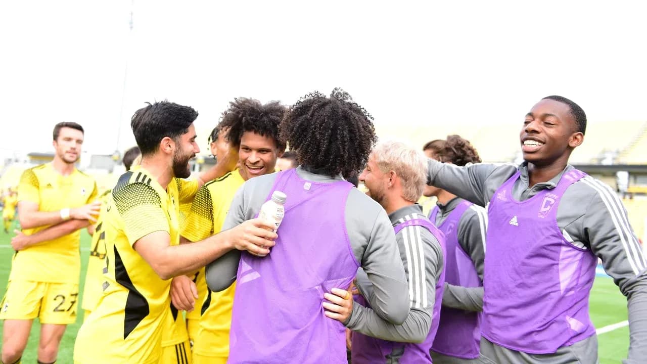 Players celebrating after the match victory