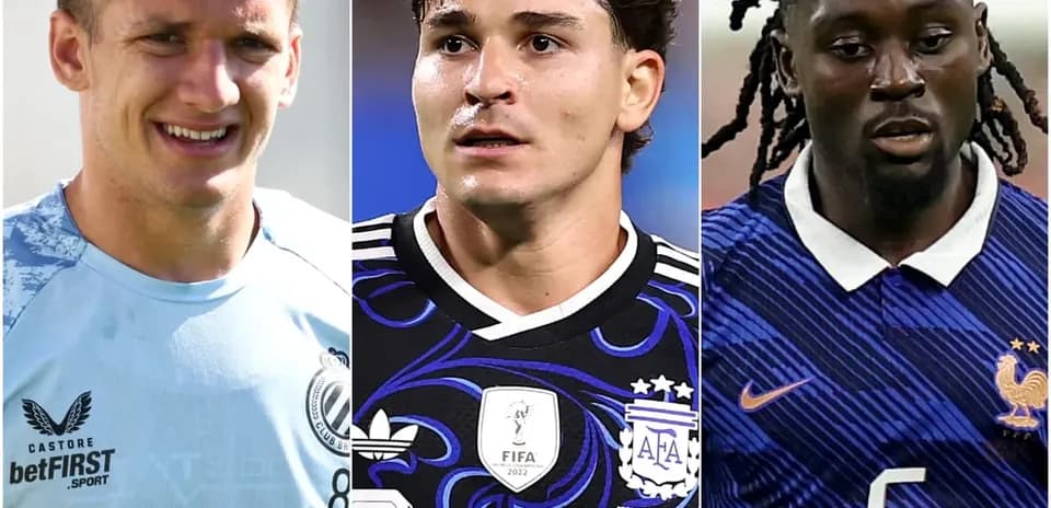 Three soccer players in team jerseys, facing camera