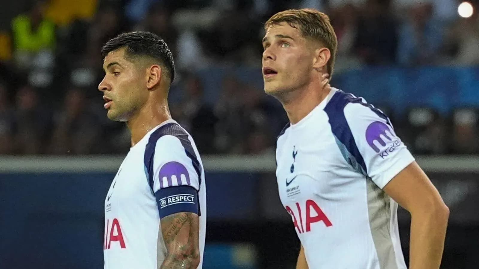 Two Tottenham players looking up during match