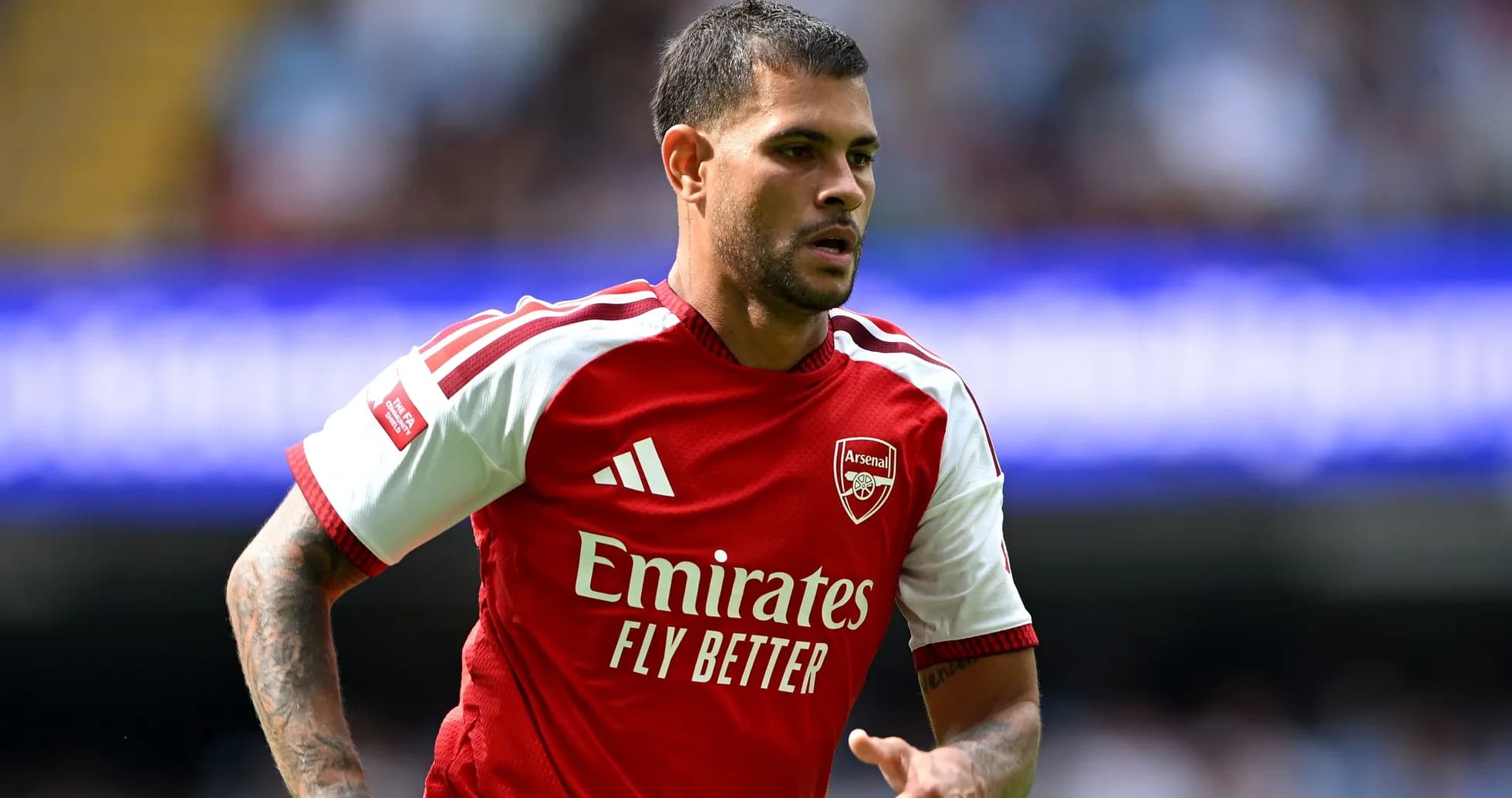 Player wearing Arsenal jersey during match action