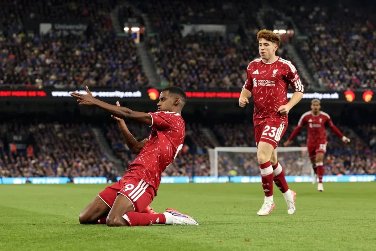 Liverpool players celebrating a goal on the pitch