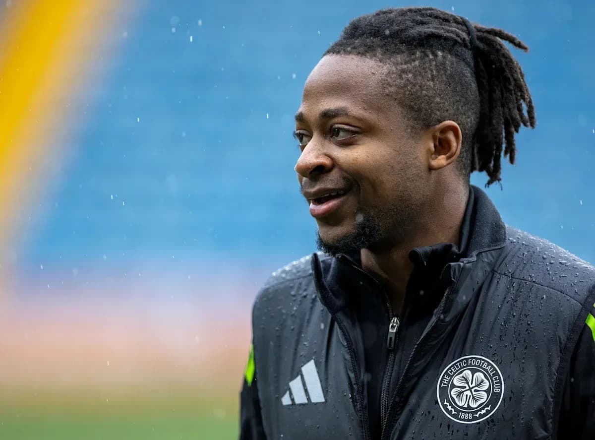 Player smiling during training in rainy conditions