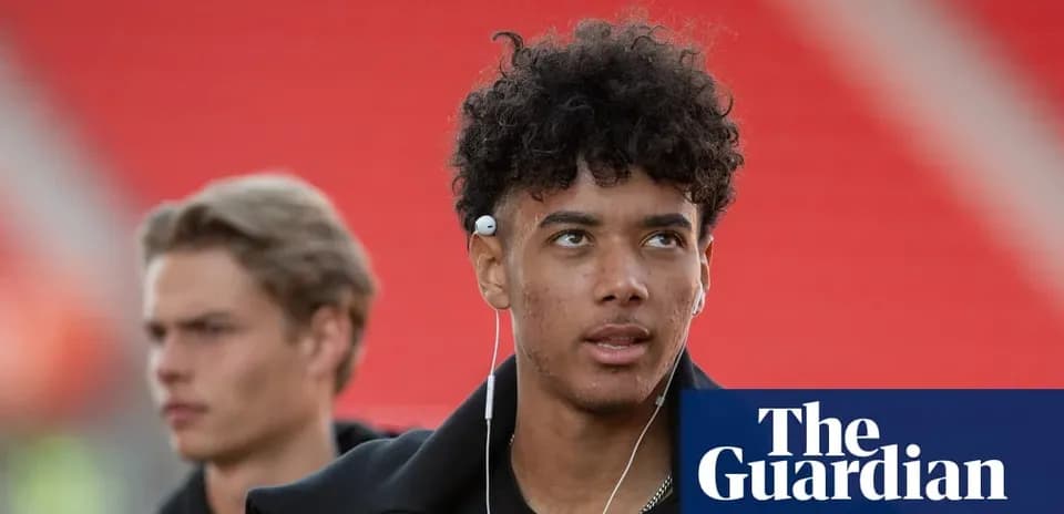 Young player wearing headphones walking before match