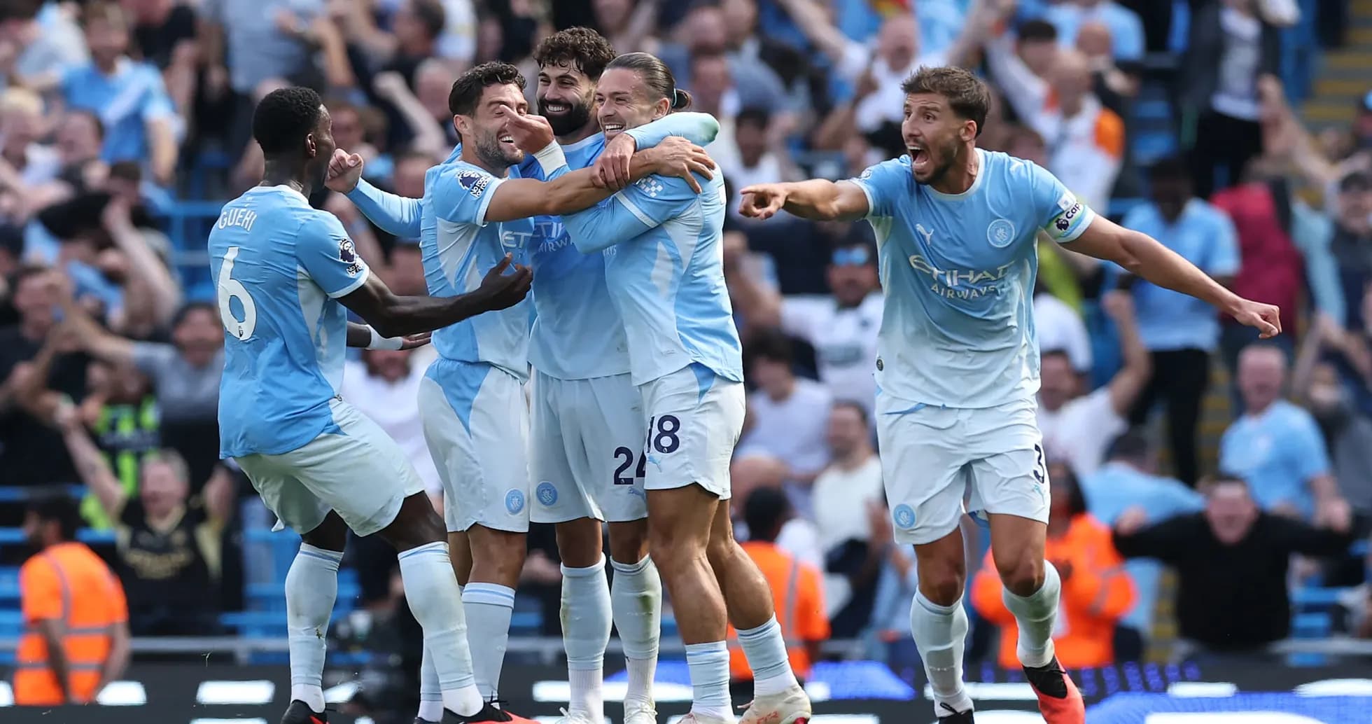 Manchester City players celebrating a goal