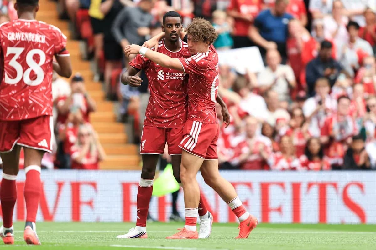 Liverpool players celebrating together on the pitch