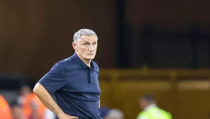 Coach observing the match from the sidelines